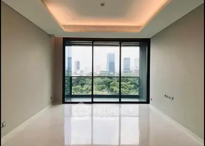Spacious modern living room with large windows and city view