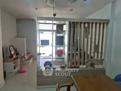 Modern living room with stylish partition and sleek furniture design