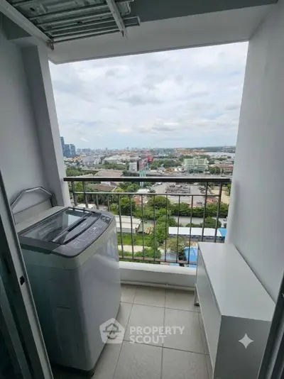 High-rise balcony with washing machine and stunning city view