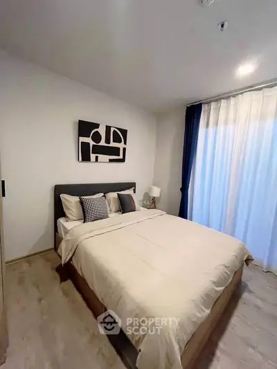 Modern bedroom with stylish decor and natural light