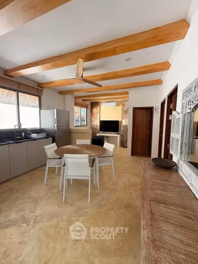 Spacious open-plan kitchen and dining area with modern appliances and stylish decor.