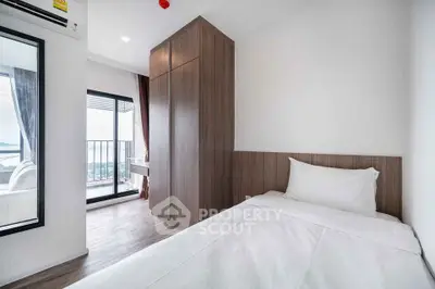 Modern bedroom with balcony view in stylish apartment