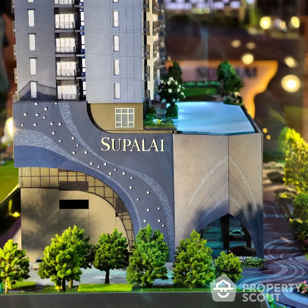 Modern architectural model of Supalai building with lush greenery and sleek design