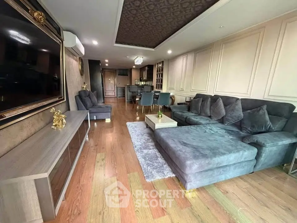 Luxurious living room with elegant decor and spacious seating area in modern apartment.