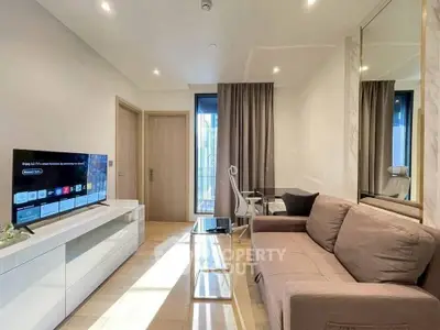 Modern living room with sleek furniture and smart TV, perfect for urban living.