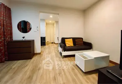 Cozy living room with modern decor and wooden flooring