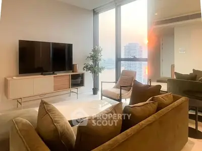 Luxurious modern living room with stunning city view, featuring elegant furniture and large windows.