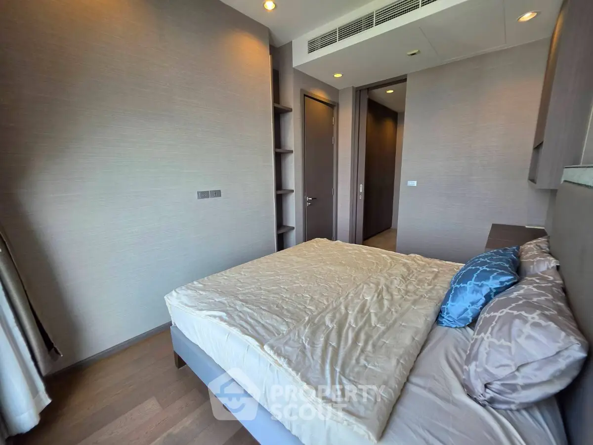 Modern bedroom with cozy bed and stylish decor in a contemporary apartment