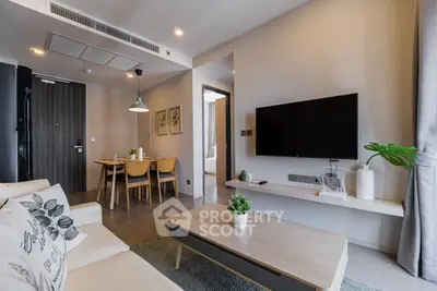 Modern living room with stylish decor and open dining area