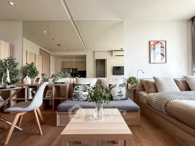 Modern open-plan living room with stylish decor and cozy seating area