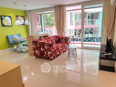 Vibrant living room with floral sofa and large windows in modern apartment
