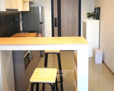 Modern kitchen with open layout and stylish bar seating