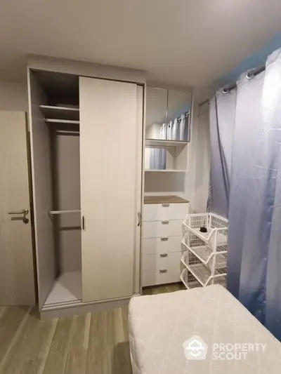 Cozy bedroom with modern wardrobe and ample storage space