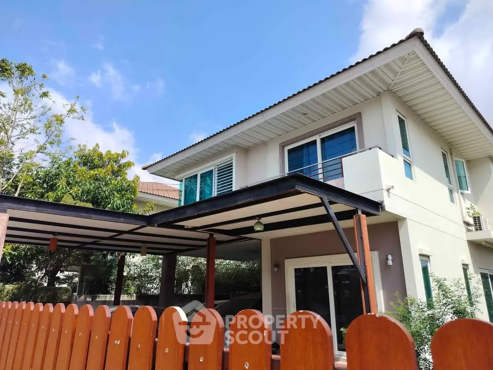Charming two-story house with modern design and spacious balcony