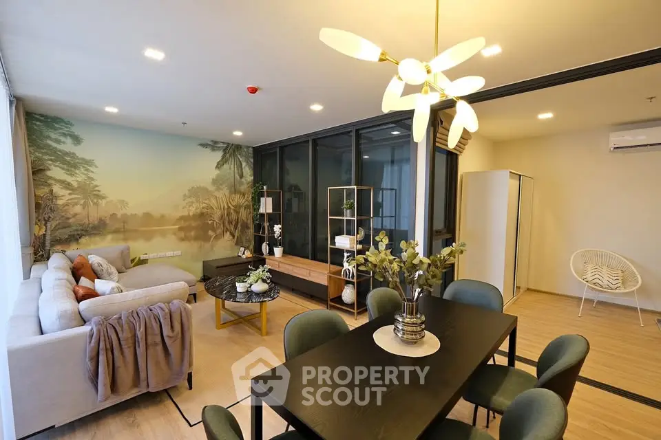 Modern open-plan living and dining area with stylish decor and natural light.