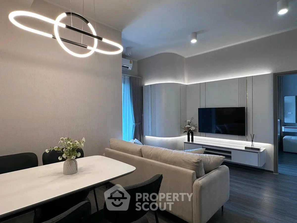 Modern living room with sleek furniture and stylish lighting in a contemporary apartment.