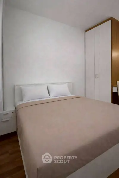 Cozy bedroom with minimalist design and ample storage space