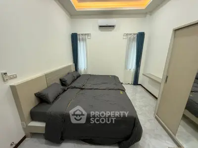 Spacious bedroom with modern design and cozy ambiance