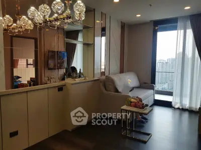Luxurious living room with city view and elegant chandelier