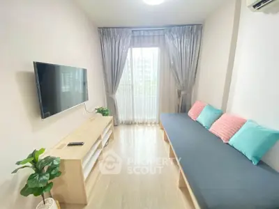 Bright living room with modern decor and large window view