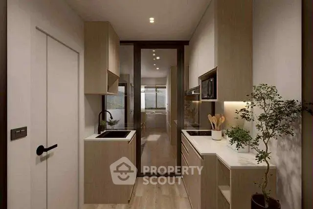 Modern kitchen with sleek cabinetry and integrated appliances in a stylish apartment.