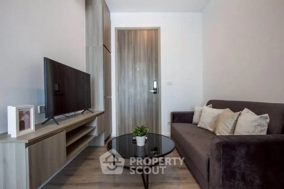 Modern living room with sleek furniture and stylish decor in a contemporary apartment.