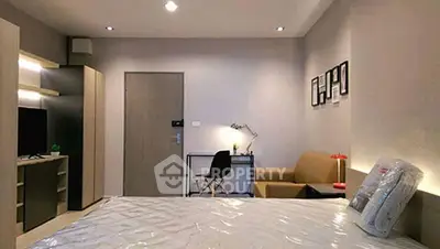Modern bedroom with stylish decor and cozy workspace