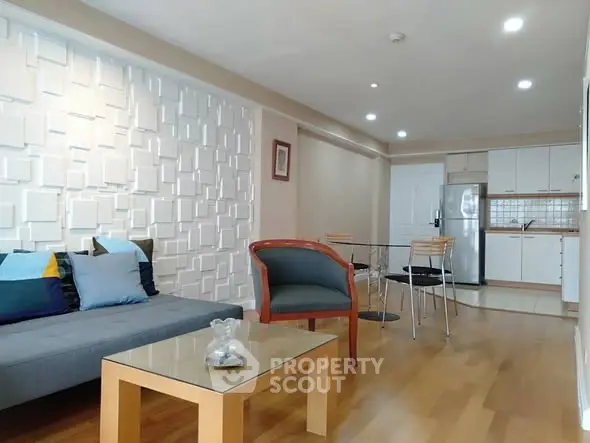 Modern living room with stylish decor and open kitchen layout