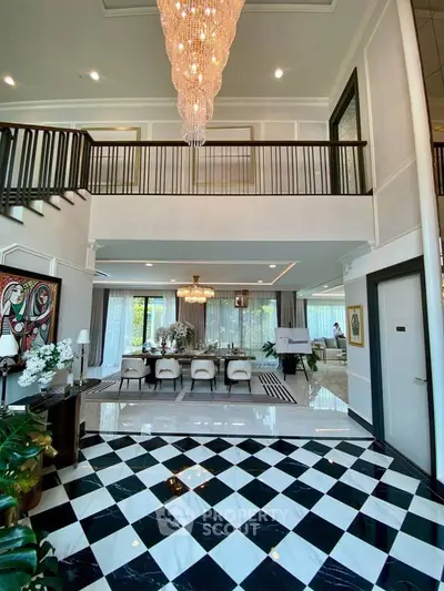 Luxurious open living room with elegant chandelier and modern decor