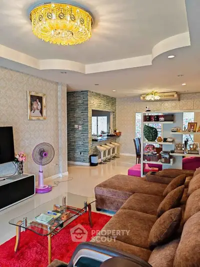 Luxurious living room with elegant chandelier and modern decor