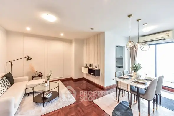 Elegant living and dining area with modern decor and natural light