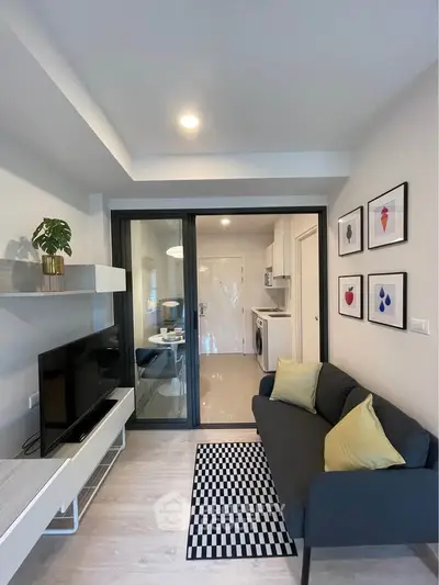 Modern living room with sleek decor and open kitchen view