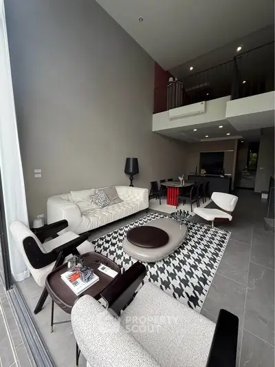 Spacious modern living room with stylish furniture and open layout