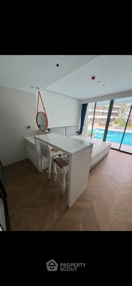 Modern bedroom with pool view and stylish decor