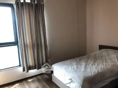 Cozy bedroom with natural light and modern decor