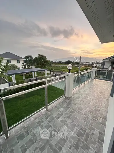 Spacious balcony with stunning sunset view in modern residential area