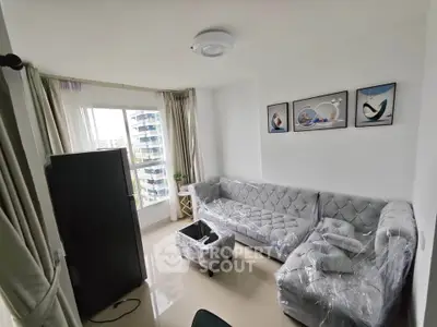 Modern living room with elegant furniture and city view, perfect for urban living.