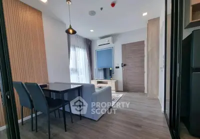 Modern living room with stylish decor and natural light in a contemporary apartment.
