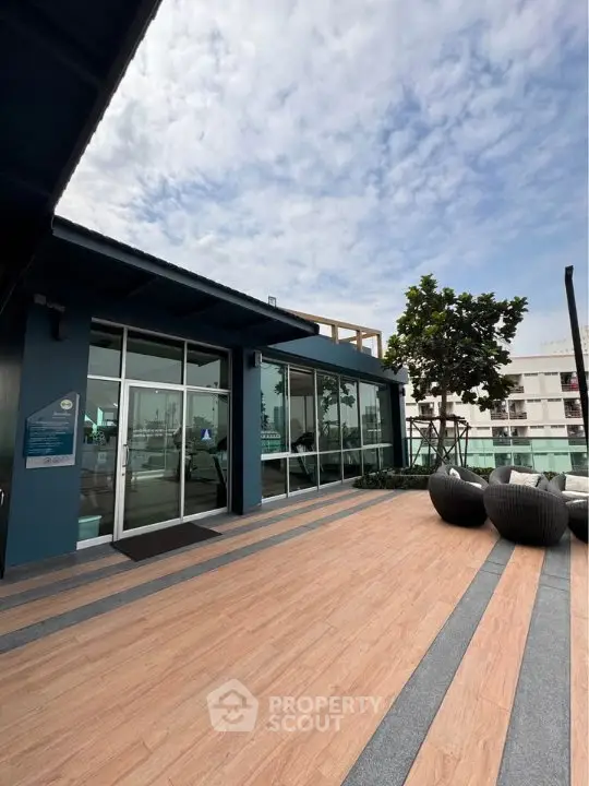 Modern rooftop terrace with stylish seating and city views, perfect for relaxation and entertainment.