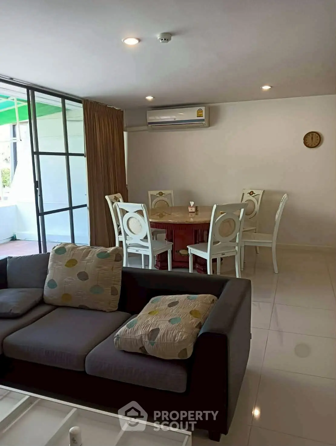 Spacious living room with modern furniture and dining area