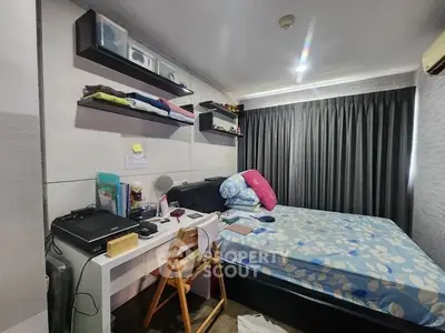Cozy bedroom with modern decor, featuring a comfortable bed, study desk, and ample storage space.