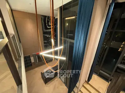 Luxurious modern living room with high ceilings and elegant lighting