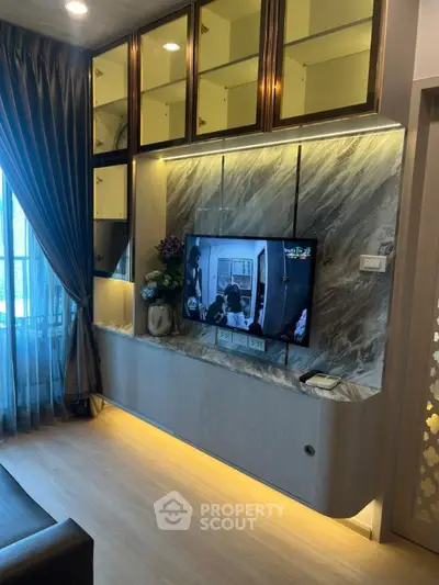 Modern living room with elegant built-in TV unit and stylish lighting