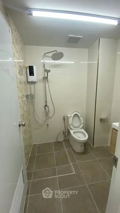 Modern bathroom with shower and toilet in minimalist design