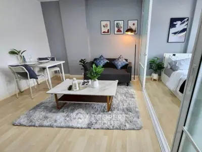 Modern living room with stylish decor and cozy seating area, perfect for relaxation and entertaining.