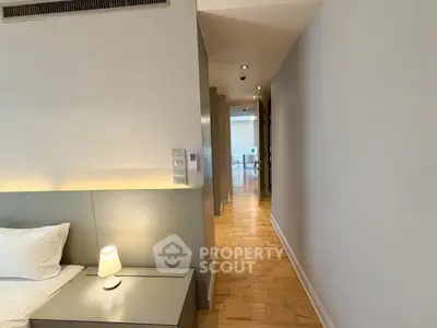 Modern bedroom with sleek design and ambient lighting in luxury apartment