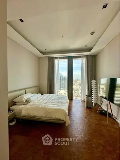 Luxurious bedroom with stunning city view and modern decor