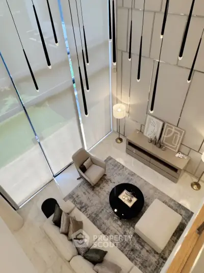 Luxurious modern living room with high ceilings and elegant lighting