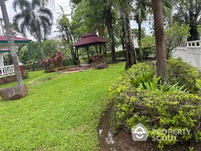 Lush garden with gazebo in serene residential area