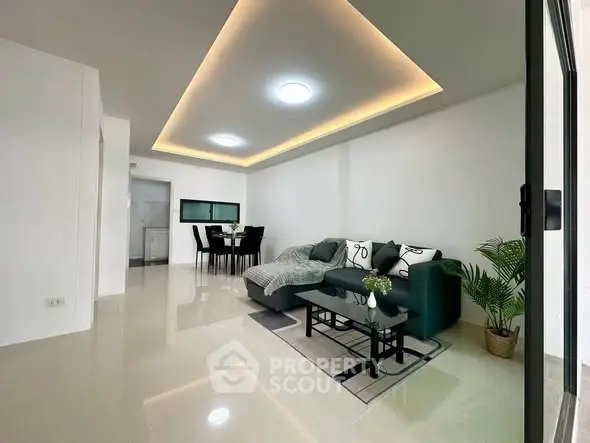 Spacious modern living room with elegant lighting and stylish furniture